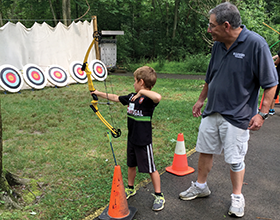 CWPD Volunteer Harry Barnes instructing archery