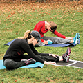 women stretching on exercise mats