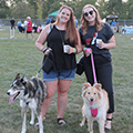 two girls with their dogs