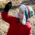 preschool boy looking at acorn