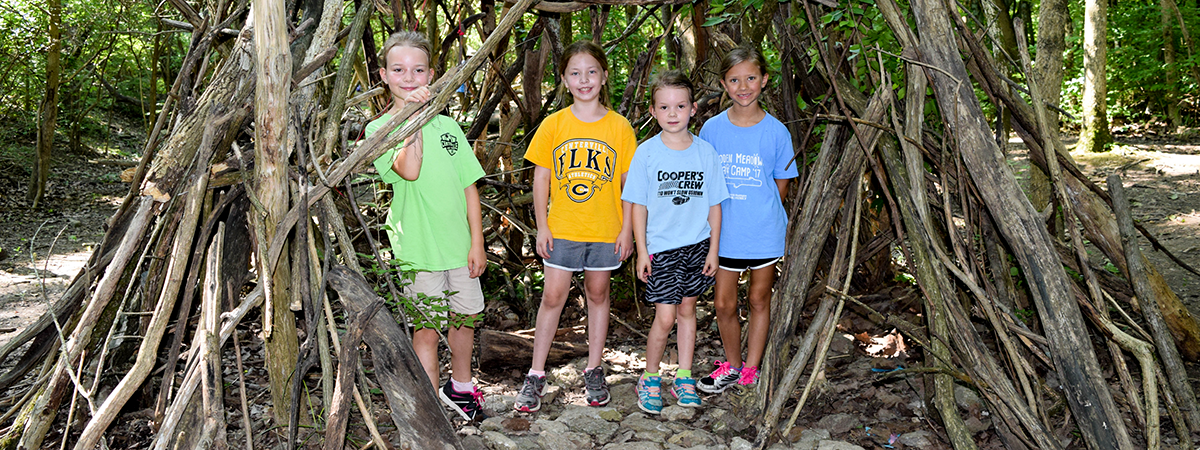 Children in a fort at summer camp