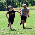 two boys running at Summer Recreation Program