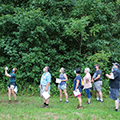 adults on a hike stopping to observe