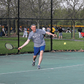 man playing tennis at Schoolhouse Park