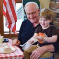 young boy on grandfather's lap