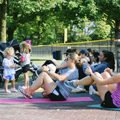 women on exercise mats outdoors