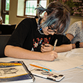 teenagers concentrating on drawing