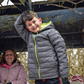 boy in a winter coat smiling