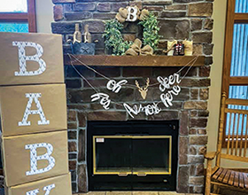 Nature Nook mantel decorated for a baby shower