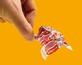 hand holding candy wrapper